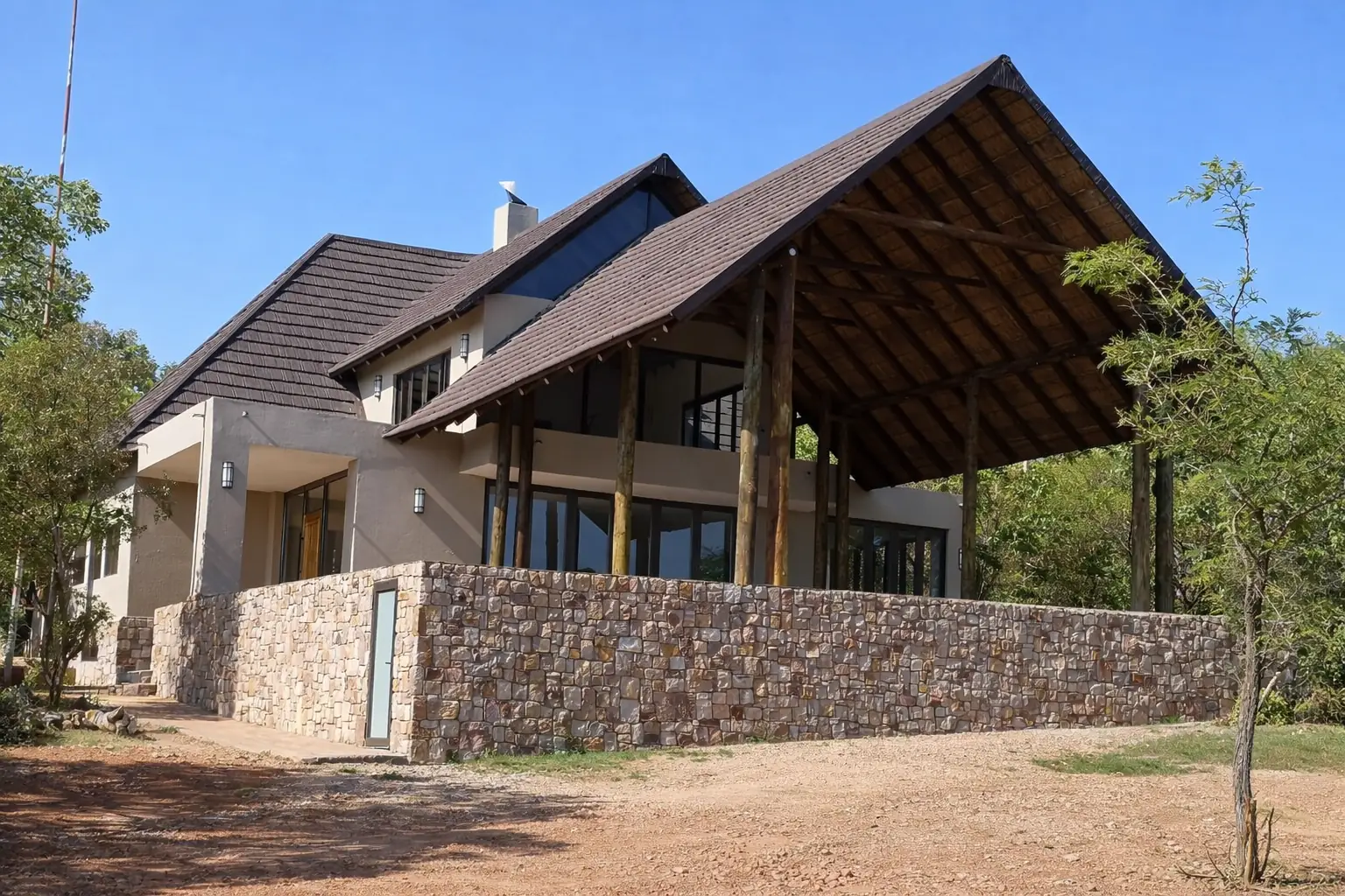 Completed private residence with stone-clad base, Mabula