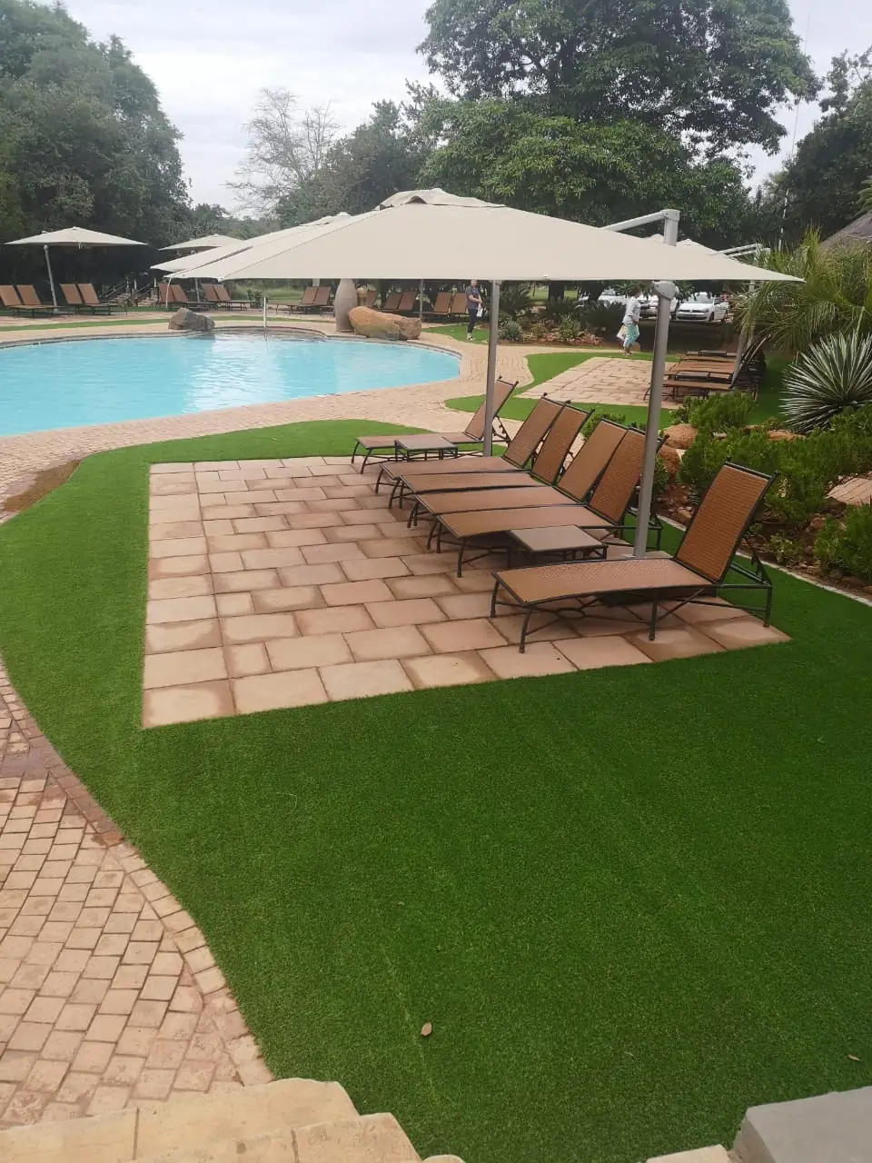 Pool-side paving and lawn at Mabula Game Lodge