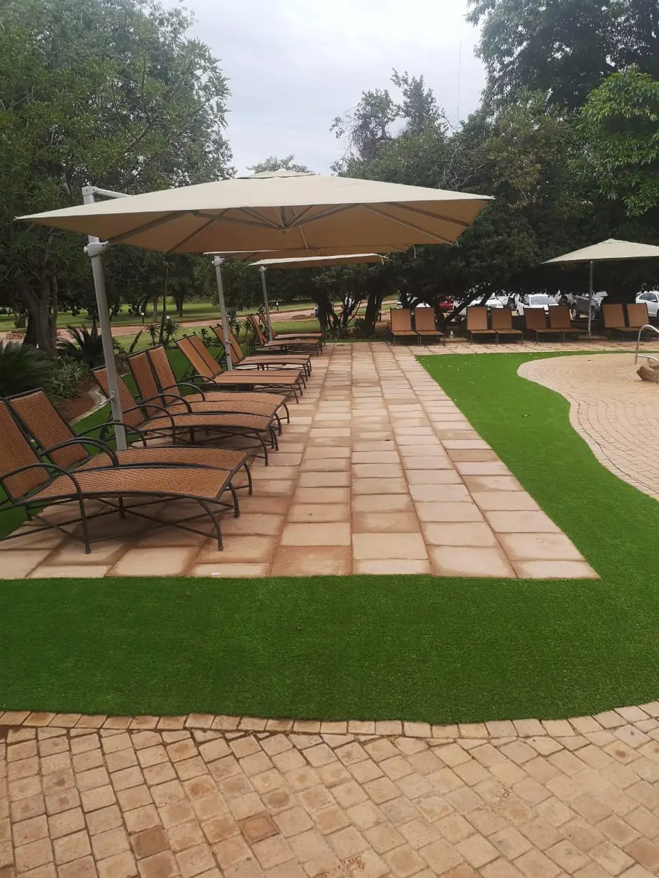 Paved walkway with loungers at Mabula Game Lodge