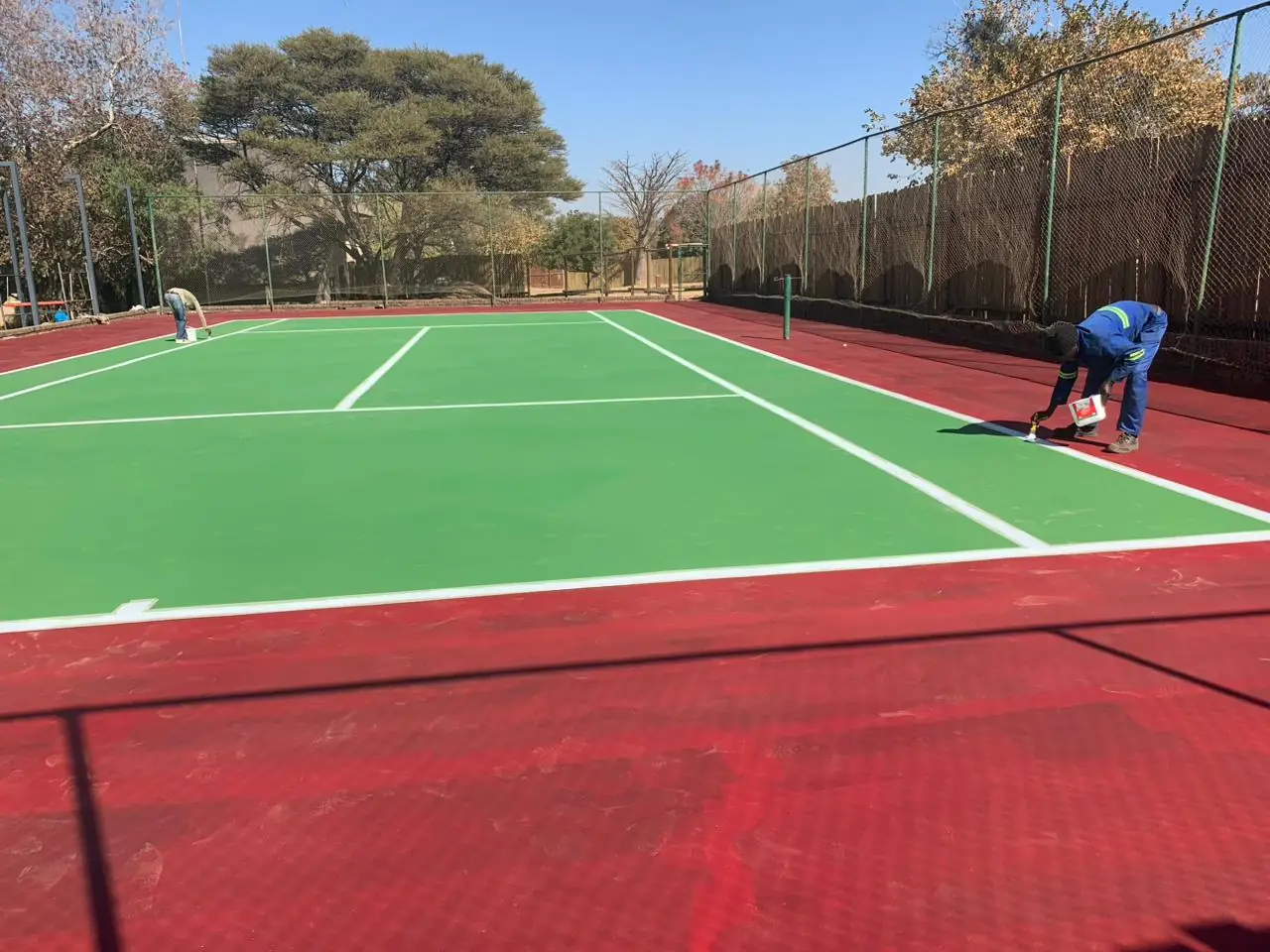 Tennis court surface finishing