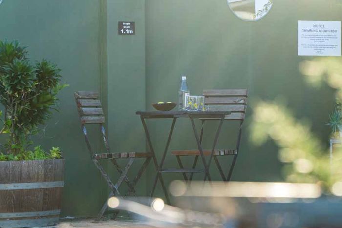 Quiet bistro table in a shaded courtyard corner