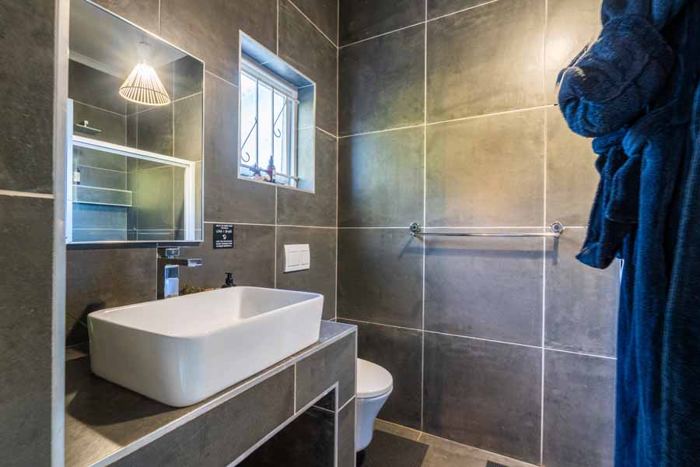 En-suite bathroom with walk-in shower in Lemon Cottage