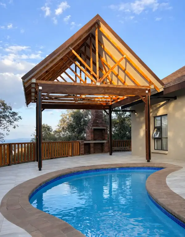 Timber lapa and curved pool with tiled deck